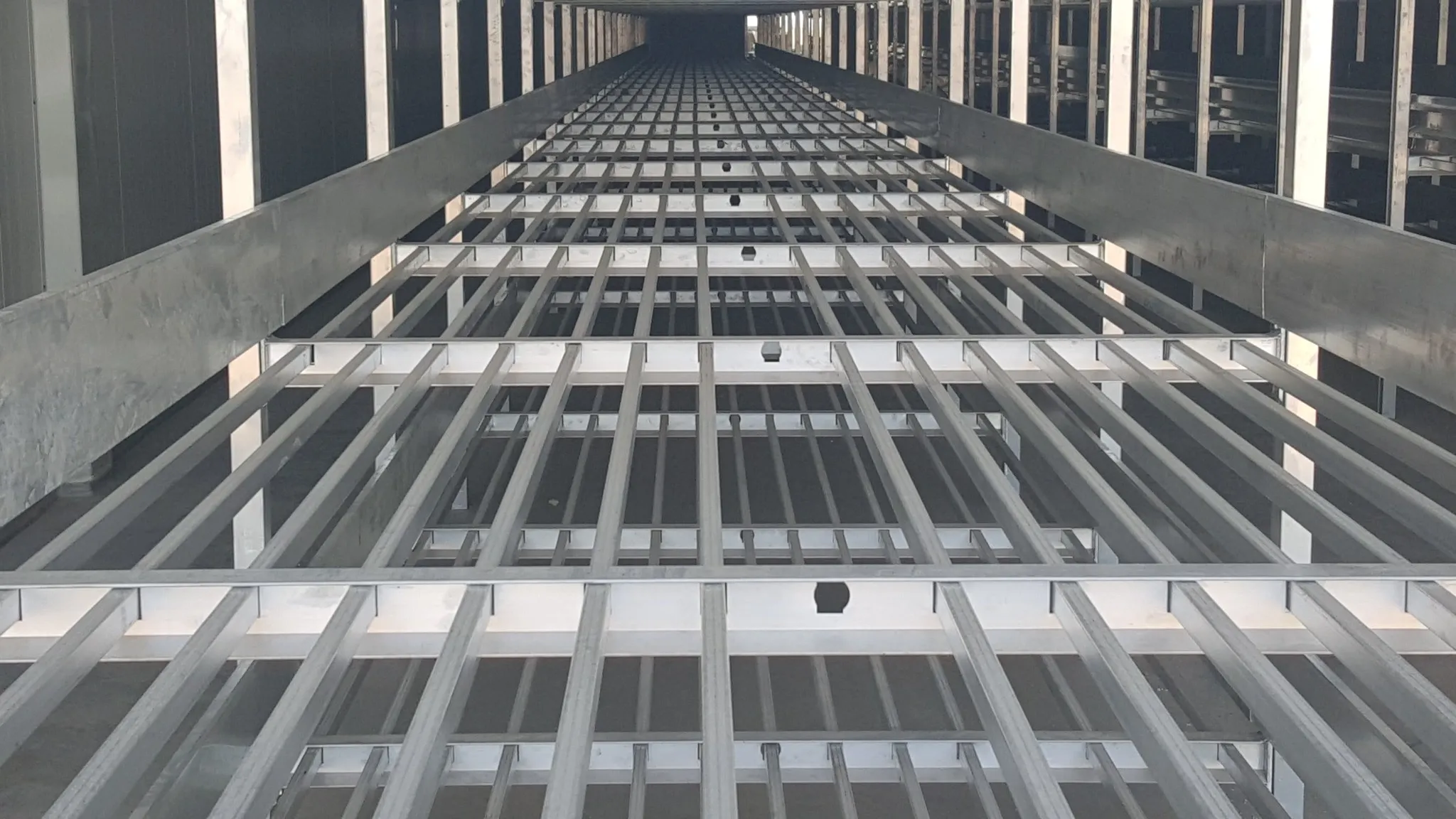 Enari growing racks — wide view across the hall